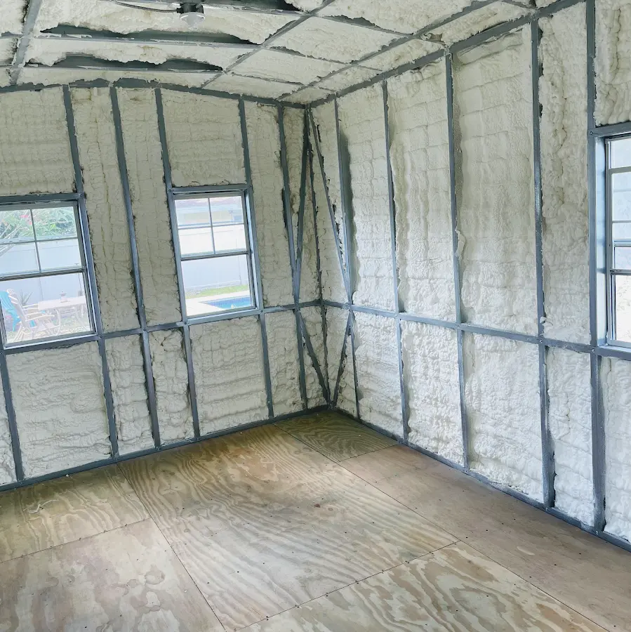 Closed-cell spray foam insulation applied to wall cavities in a residential project in Brewster